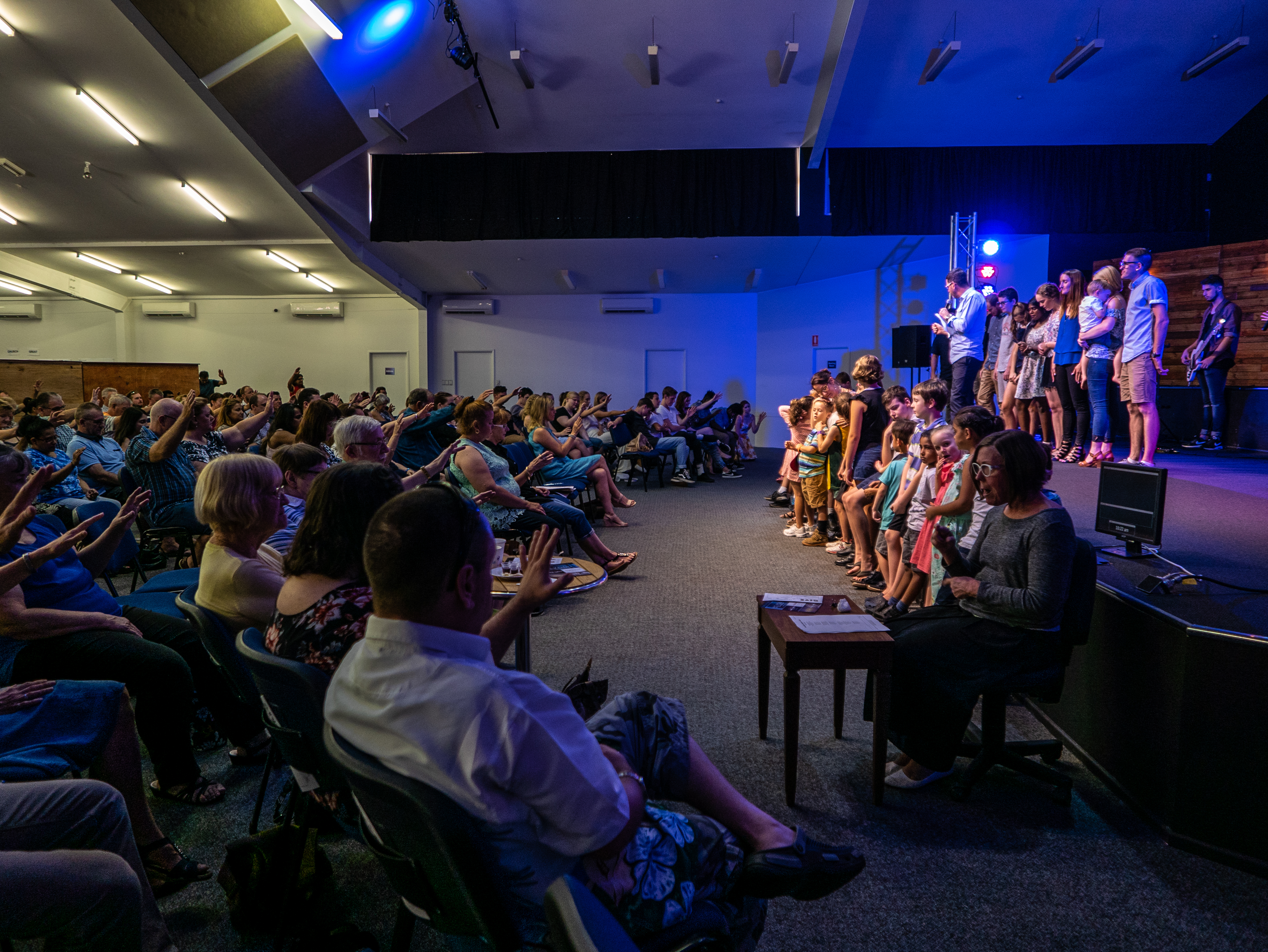 Children and families gathering for midweek ministry